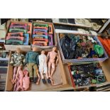 A shelf of Action man toys and accessories including four figures, one 'moving eyes and gripping