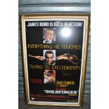 A James Bond 'Goldfinger' framed film poster bearing signature [next to office door] TO BID