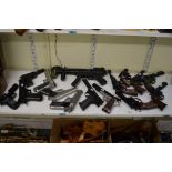 An extensive collection of plastic replica hand guns, comprising a submachine gun, six revolvers,