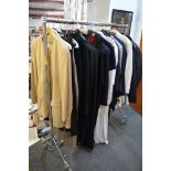 A rail of mainly ladies' designer clothing including a Cerruti suit, Paul Costelloe, Mariella