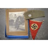A German Nazi Third Reich pennant or bunting, printed on cotton; a vintage photograph of Churchill