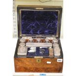 A good Victorian vanity case in figured walnut, apparently complete with glass and silver-plated