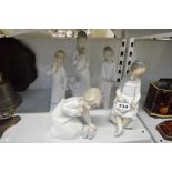 Five Spanish porcelain figures of children, including two by Lladro, the others by Nao, D'Art, and
