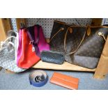 A large tote shoulder bag in brown Louis Vuitton monogram print, an E Goyard print tote bag, a