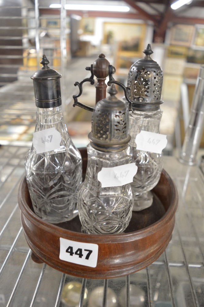 A rare Georgian turned wood circular cruet stand with unmarked silver handle and with three cut-