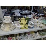 Two shelves of mixed china and glassware including Wedgwood Lichfield pattern part tea and dinner