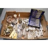 A carton of silver-plated items, including Old English pattern cutlery, pair of reproduction