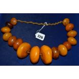 A dramatic modern necklace of amber rocks TO BID ON THIS LOT AND FOR VIEWING APPOINTMENTS CONTACT