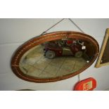 A turn of the century copper hammered oval bevelled mirror TO BID ON THIS LOT AND FOR VIEWING