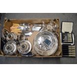 A carton of plated items, including a tea and coffee service, dishes, cutlery, casters, etc. TO