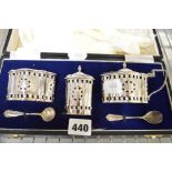 An impressive Elizabeth II silver condiment set in case, of large size, with pierced decoration,