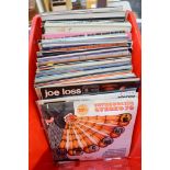 A crate of 12 in records including classical, Latin, brass bands, film soundtracks and themes,