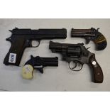 Four replica hand guns, in black finish, comprising Bruni Automatic 8 mm K; MGC mod. SW/7 357 snub-