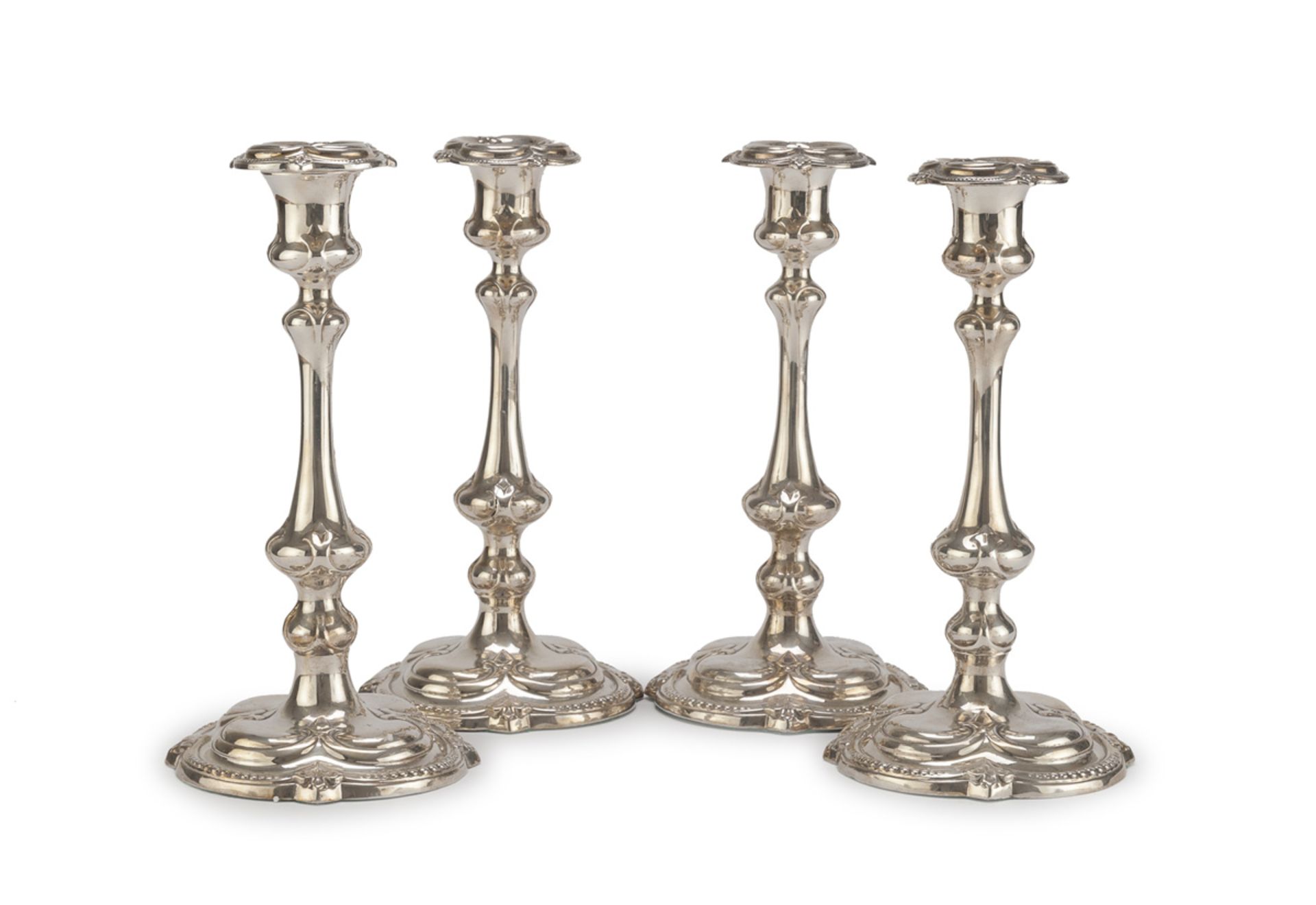 FOUR SILVER-PLATED CANDLESTICKS PUNCH SHEFFIELD 19TH CENTURY