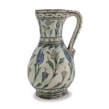 A TURKISH POLYCHROME ENAMELED PITCHER 17TH CENTURY