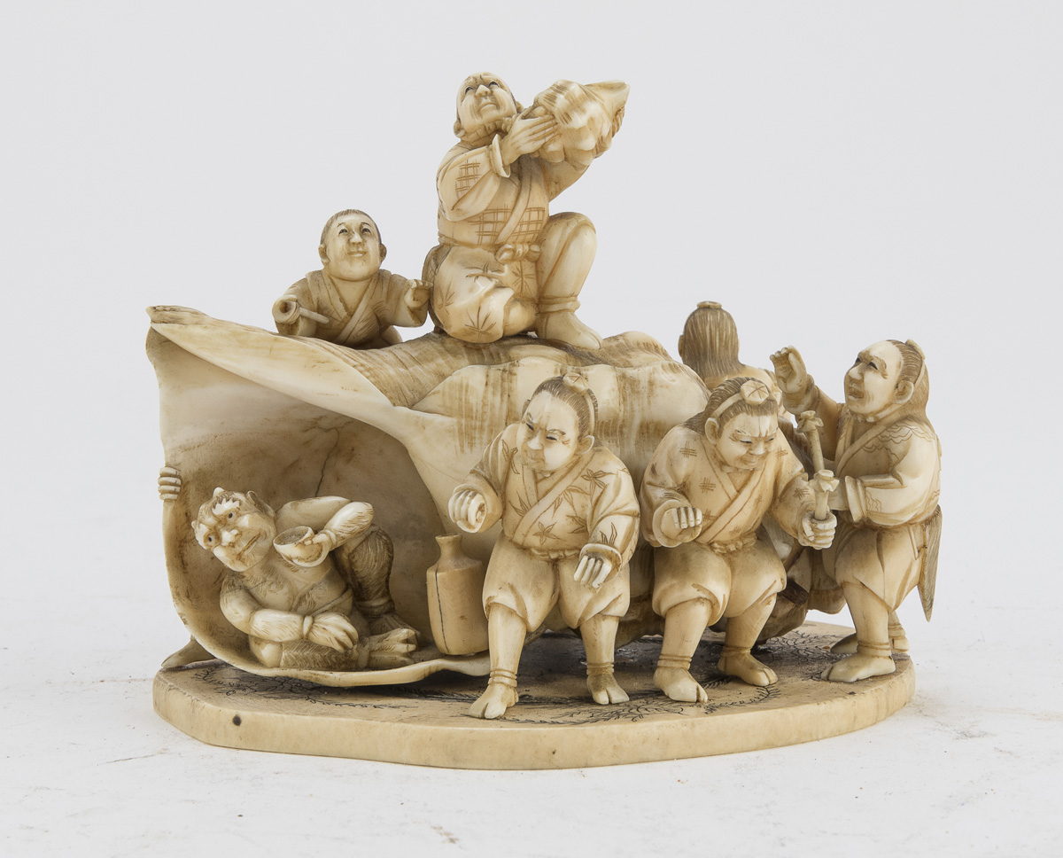 AN ALLEGORICAL JAPANESE IVORY GROUP LATE 19TH CENTURY.