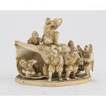 AN ALLEGORICAL JAPANESE IVORY GROUP LATE 19TH CENTURY.