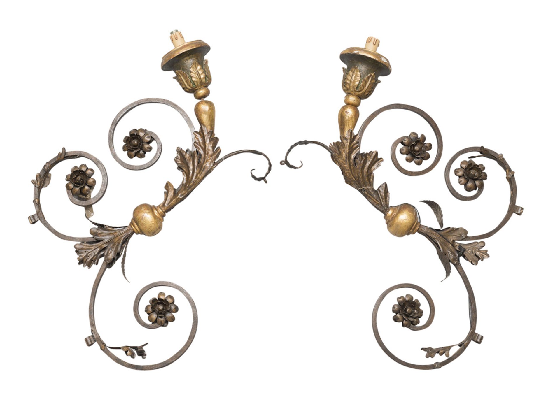 A PAIR OF LARGE WALL ARMS IN WROUGHT IRON, 19TH CENTURY