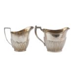 TWO SILVER AND SILVER-PLATED MILK JUGS UNITED KINGDOM EARLY 20TH CENTURY