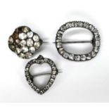 A group of three Georgian and later paste brooches, comprising an open heart shape, open oval shape,