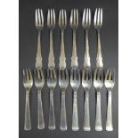Two sets of Danish silver cake forks, comprising a set of eight by Carl M. Cohr, Johannes
