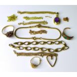 A group of 9ct gold jewellery, including a flowerhead ring set with garnets, an amethyst pendant,