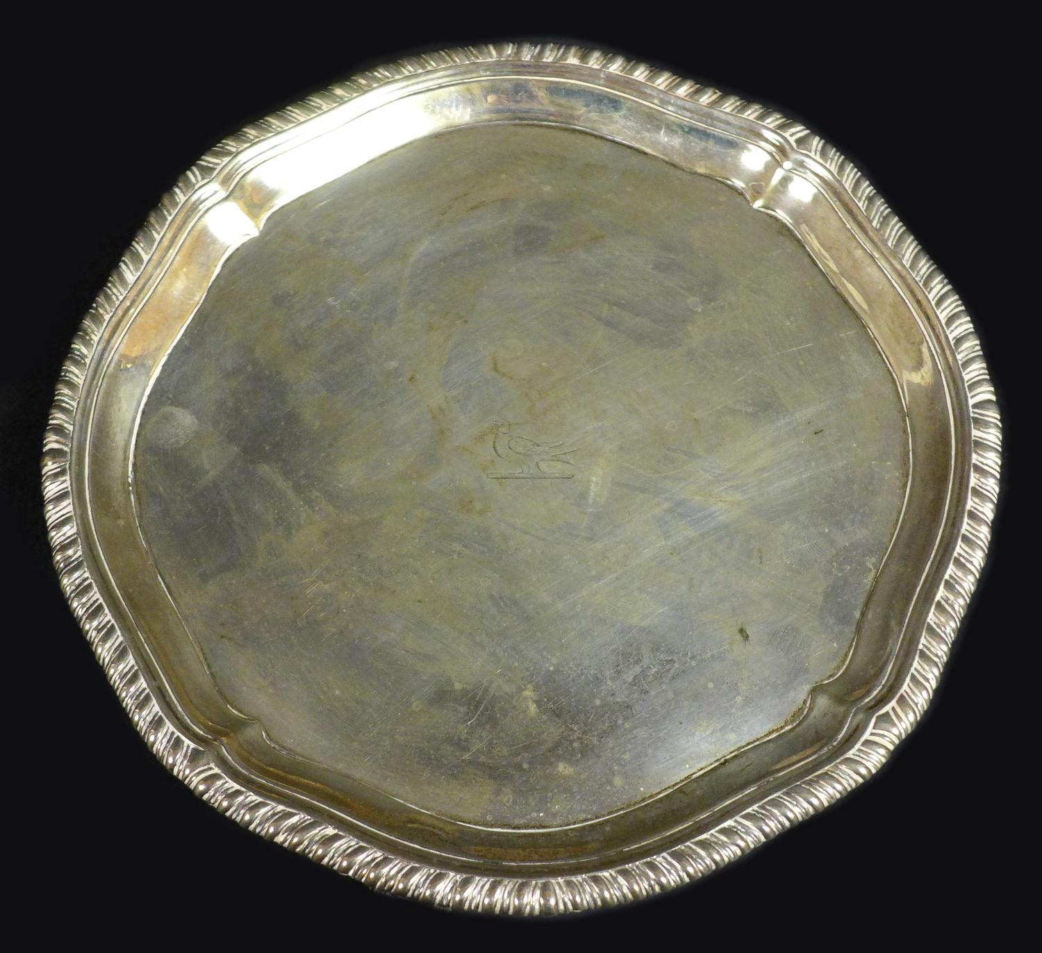 A George III small silver tray, of octagonal form with reeded rim, three scroll feet, maker's