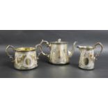 A Victorian three piece silver tea set, comprising a teapot with fruit finial, 23.5 by 13.5 by