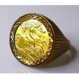 A George V gold half sovereign, 1912, inset within gentleman's 9ct gold ring, size V, 9.5g total.
