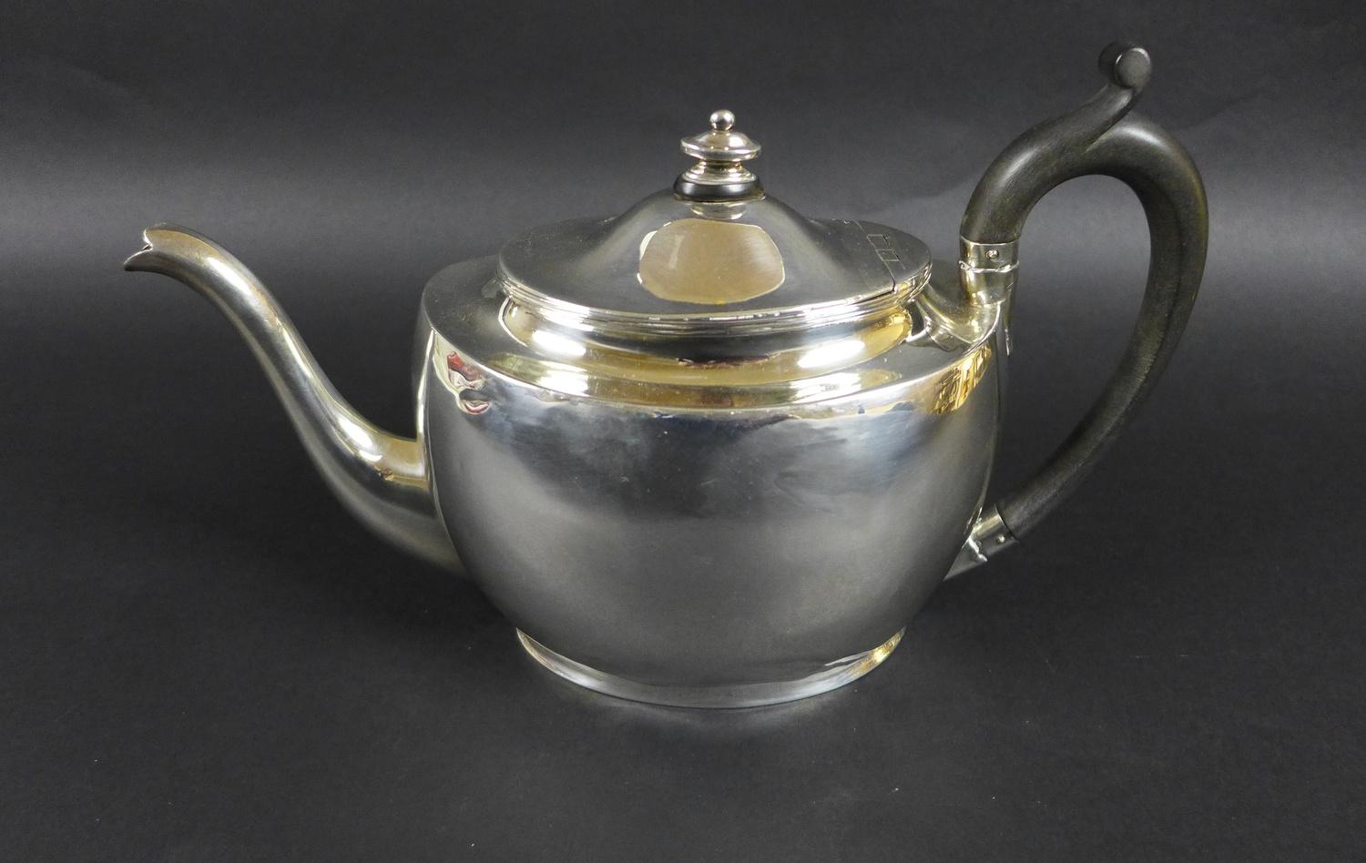 A George III silver teapot, with silver and ebony finial, ebony handle, possibly William Hall,