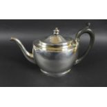 A George III silver teapot, with silver and ebony finial, ebony handle, possibly William Hall,