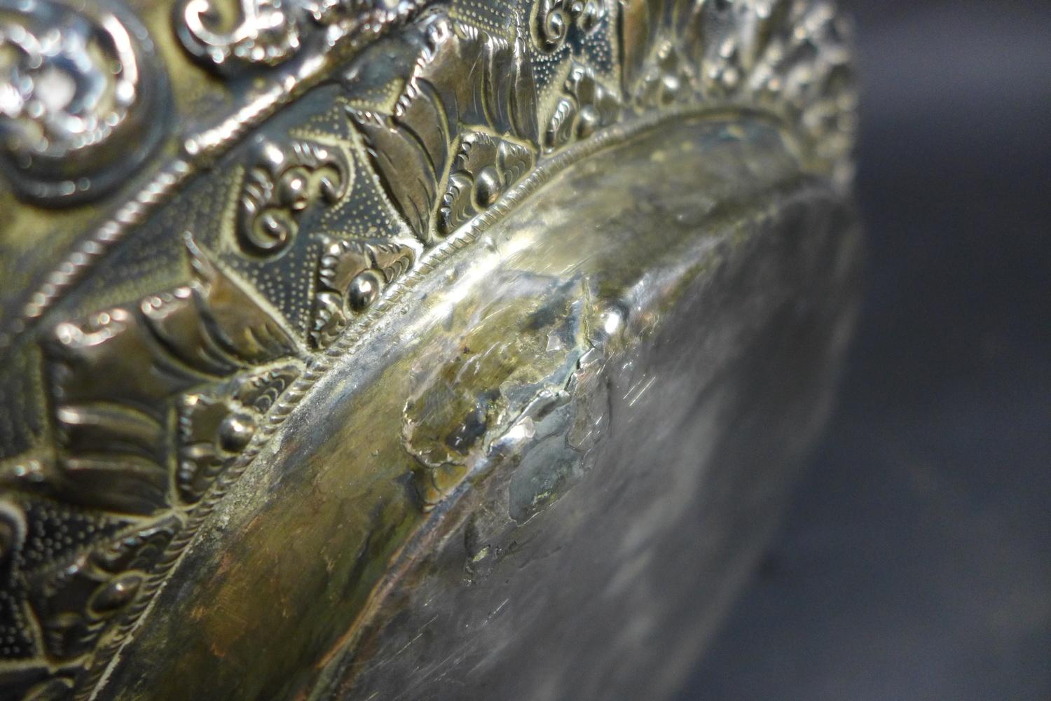 A late 19th century Thai silver large bowl, repousse decorated in relief with three face masks and - Image 10 of 10