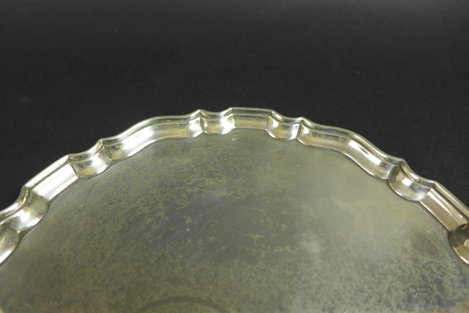 A George V silver tray, of circular form with Chippendale pie crust edge, raised on three feet, - Image 4 of 7