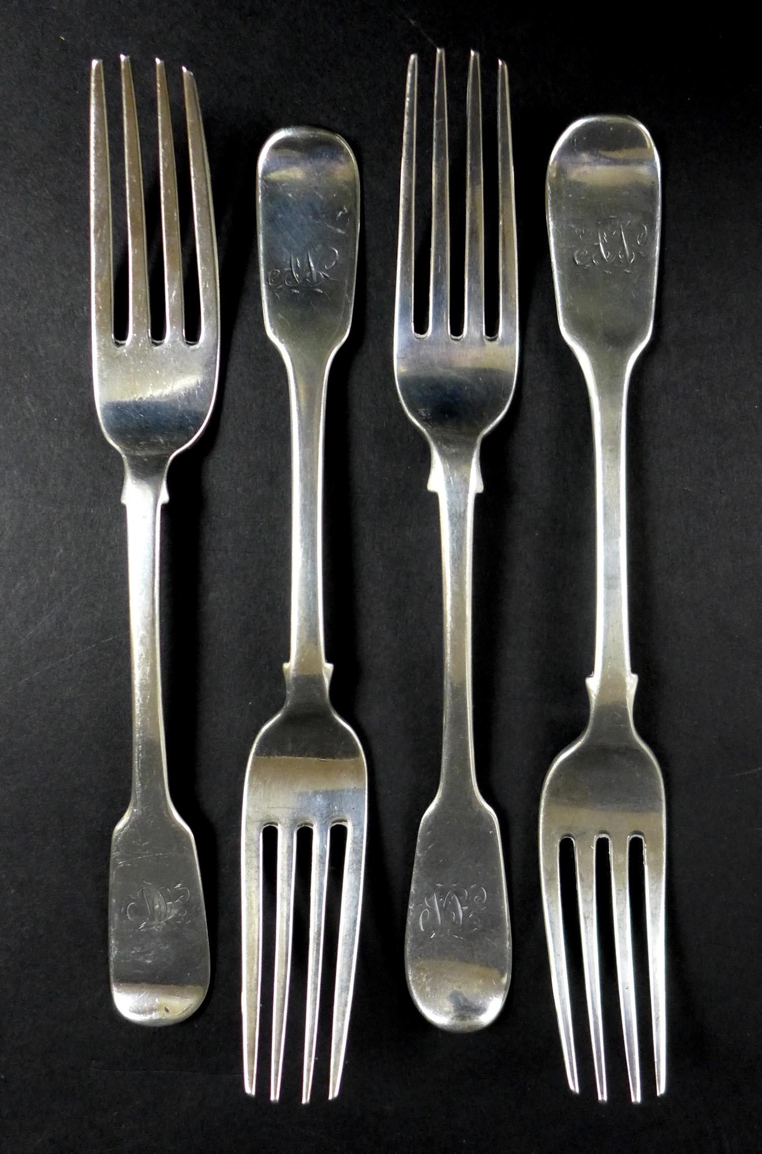Four George IV silver table forks, all with 'A N' monograms, two by Patrick Leonard, Sheffield,