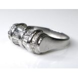 An Art Deco style platinum and diamond ring of unusual tapered barrel design, set with twelve