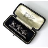 A silver bar brooch in the form of three birds with a sheaf of corn, stamped 925 verso, 4.6cm,