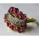 A 14ct gold, diamond and ruby Faberge ?Firebird? ring, by Franklin Mint, the six graduated brilliant