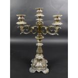 A Continental white metal candelabra, late 19th century, in Rococo style with scrolling foliate