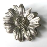 A silver sunflower brooch by Mellerio dits Mellor, stamped to back 'Mellerio Mellor, Paix 9, Paris',