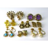 Eight pairs of 9ct gold earrings, all clip on or screw back styles, including a pair of spherical