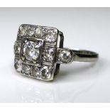 An Art Deco diamond, 18ct white gold and platinum cluster ring, with central stone approximately 0.