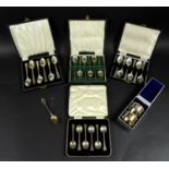 Four cased sets of six George V and later silver teaspoons, comprising a George V set of six