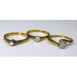 A group of three 9ct gold and diamond solitaire rings, diamonds sized between 0.1 and 0.2ct, size