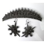 A 19th century steel cut tiara set, with brooch pin backing, 10 by 2.6cm, together with a pair of