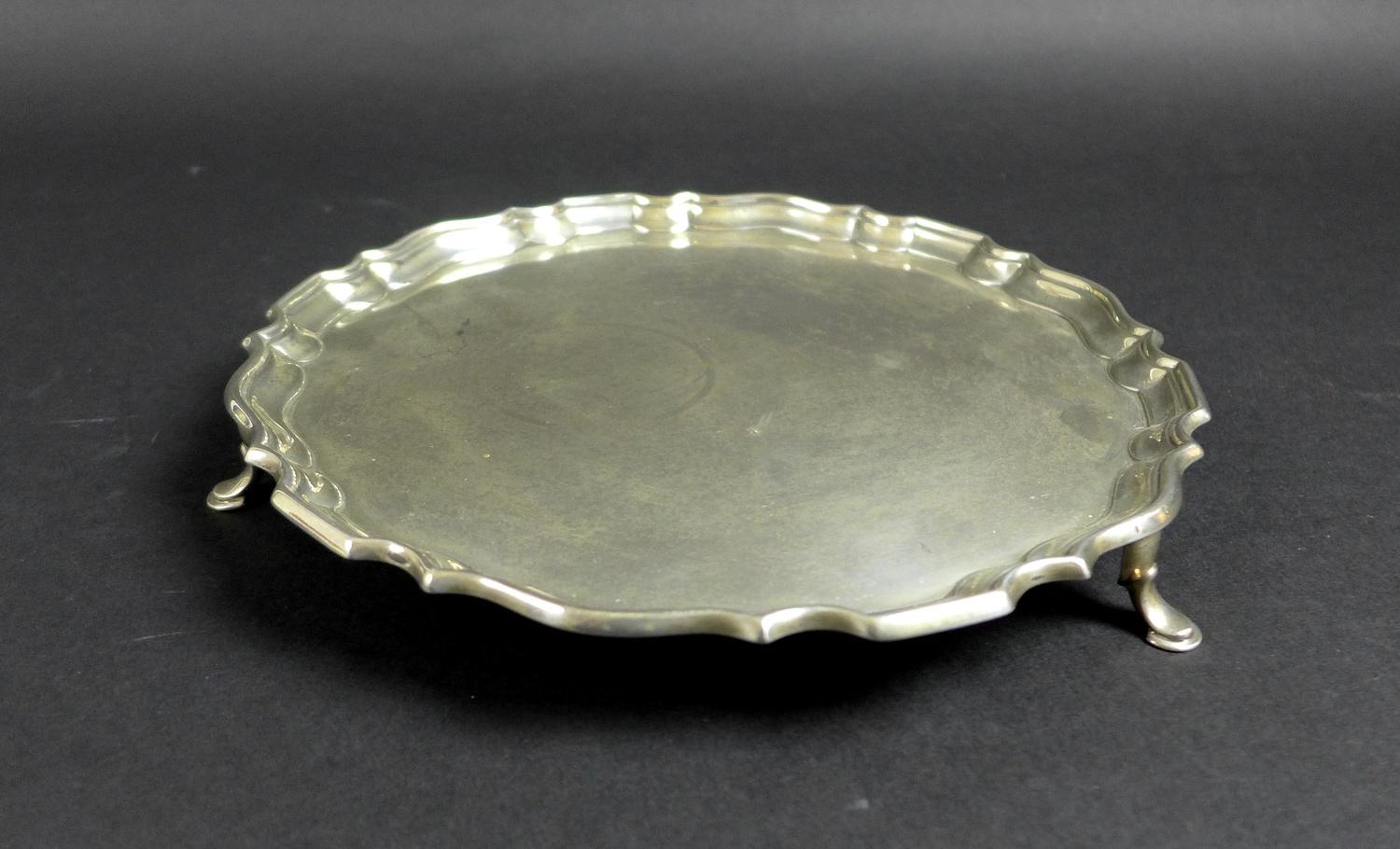 A George V silver tray, of circular form with Chippendale pie crust edge, raised on three feet, - Image 2 of 7