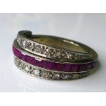 A blue sapphire, ruby and diamond night and day flip over eternity ring, set within an unmarked 18ct