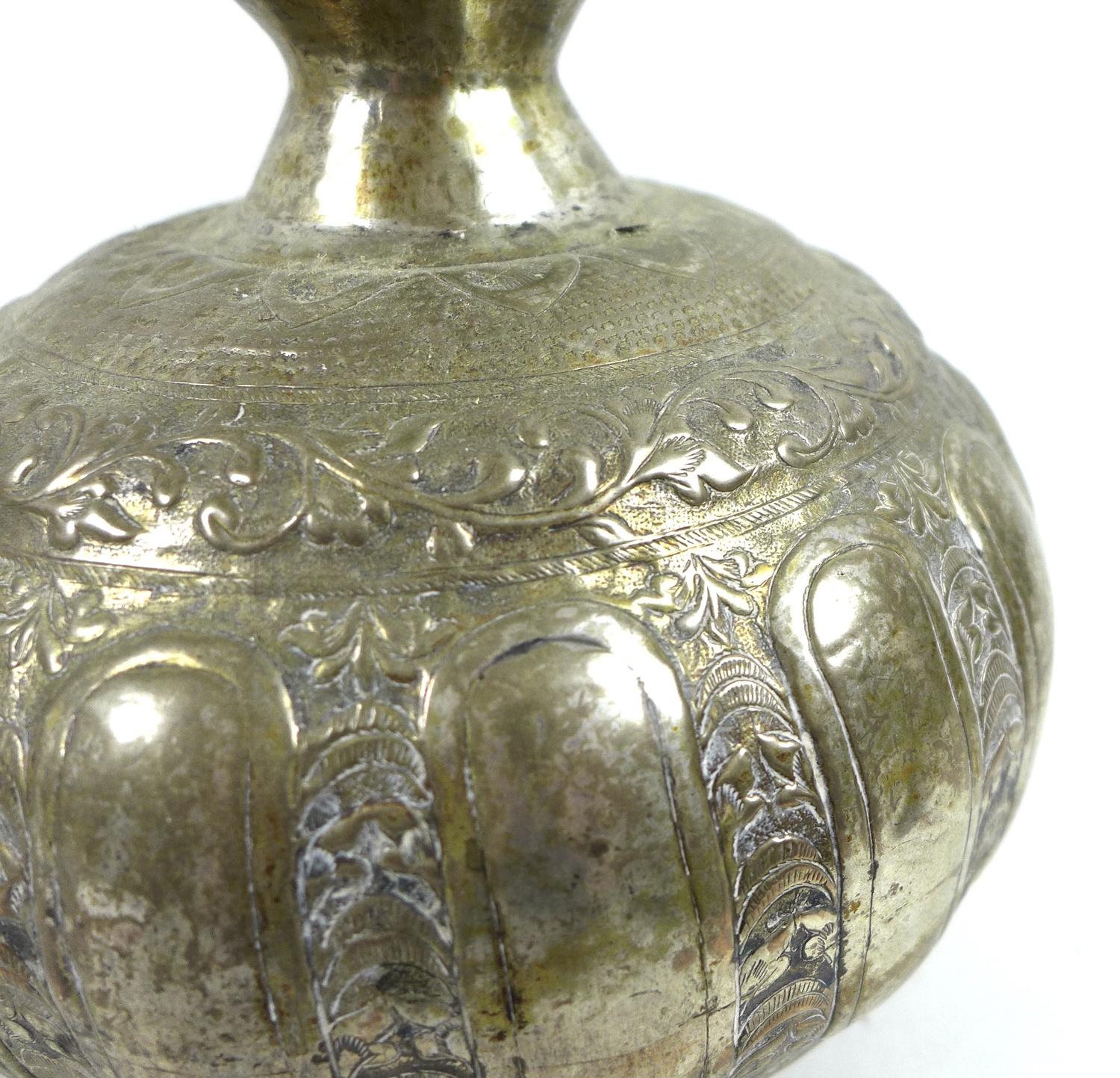 A white metal or brass silvered bottle vase, likely 19th century Indian the gourd form base - Image 2 of 5