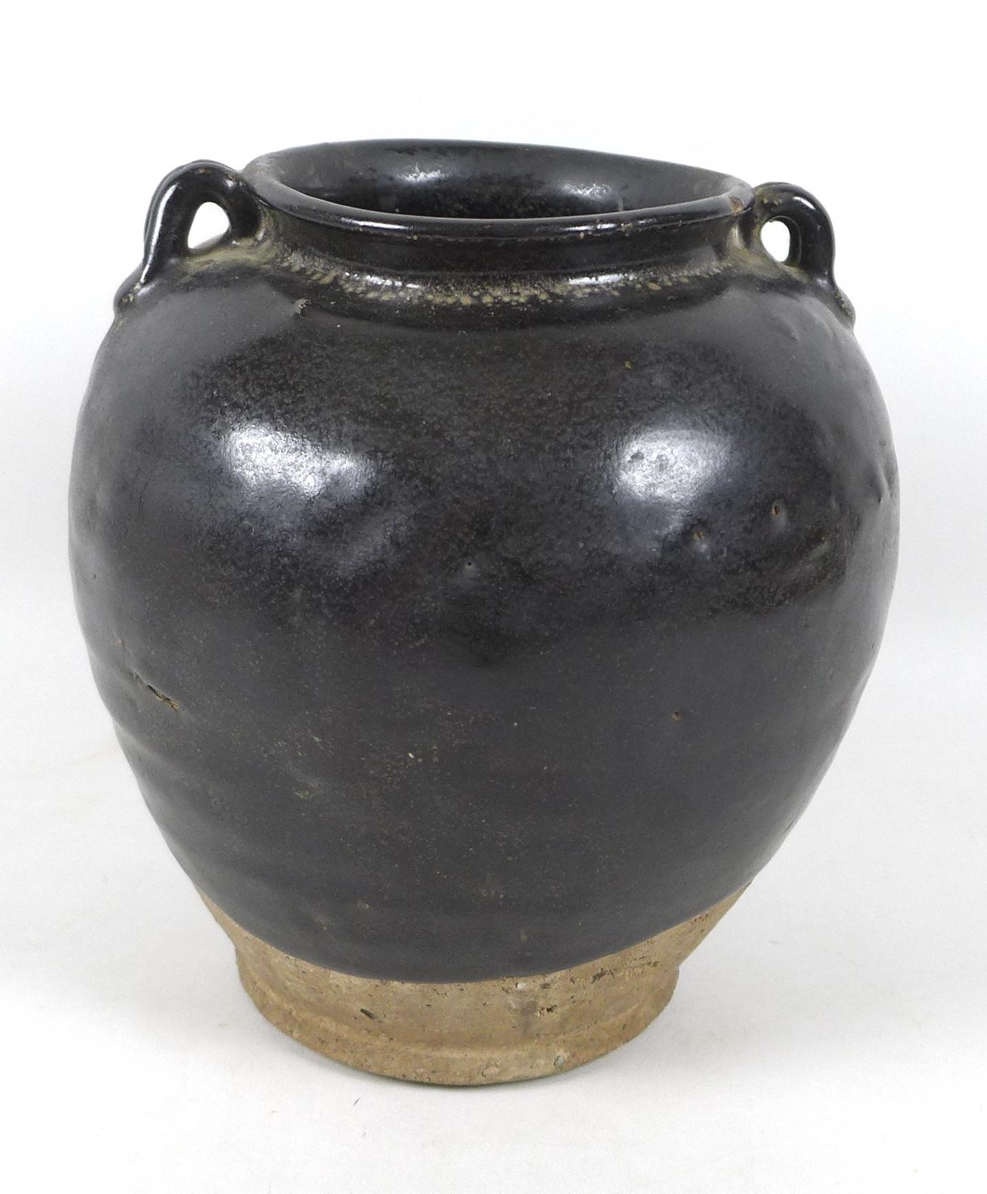 A Chinese stoneware vase with black glaze, in Song style, two small loop handles to the shoulders,