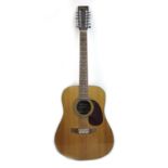 A Vintage V400-12 string acoustic guitar, with rosewood fingerboard, spruce top, tortoise shell