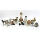 A group of Russian animal figurines, including two USSR racoons, tallest 14cm, a Lomonosov